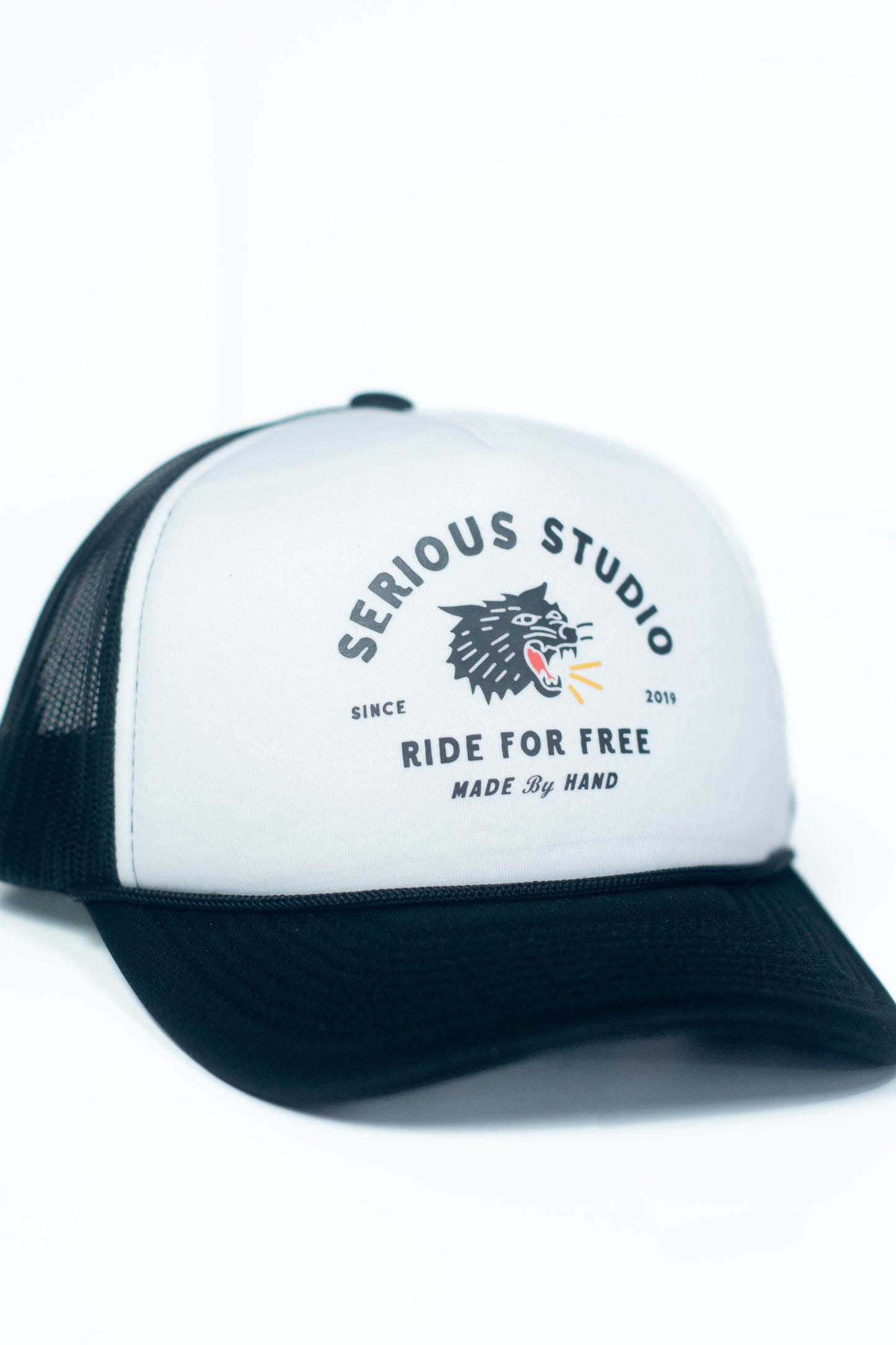 *PRE-ORDER* SERIOUS STUDIO ICONIC TRUCKER HAT - BLACK / WHITE