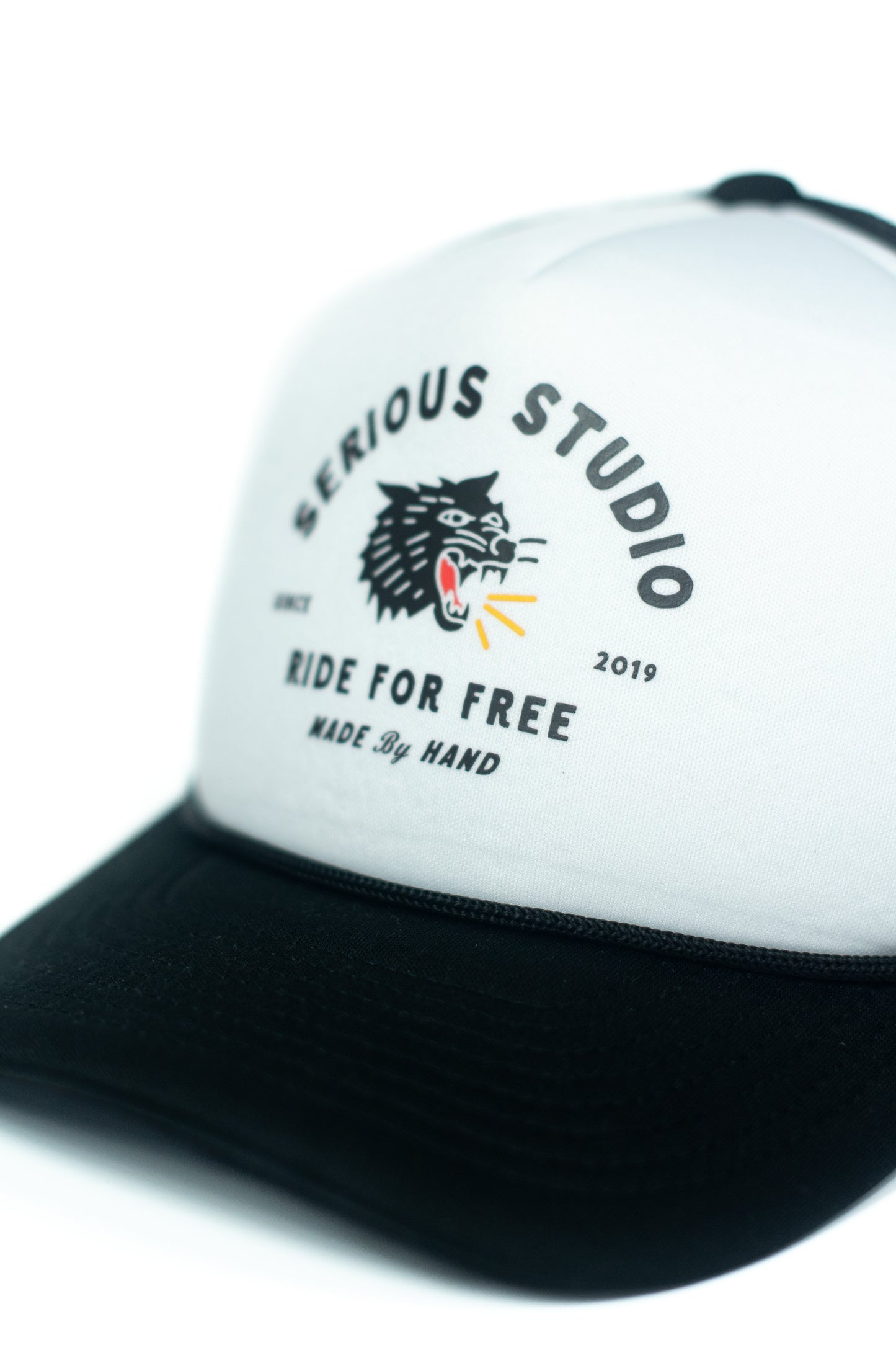 *PRE-ORDER* SERIOUS STUDIO ICONIC TRUCKER HAT - BLACK / WHITE